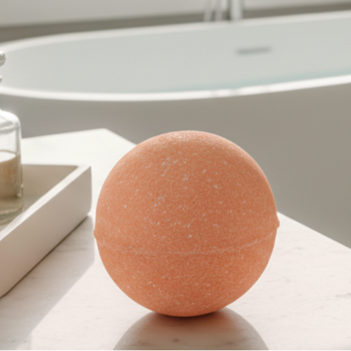 single orange bath bomb in a bathroom