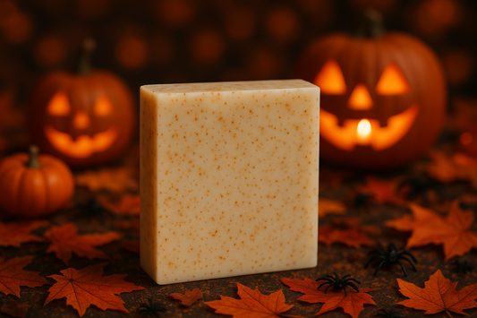 unscented rectangular homemade soap with fine apricot seeds on a halloween background